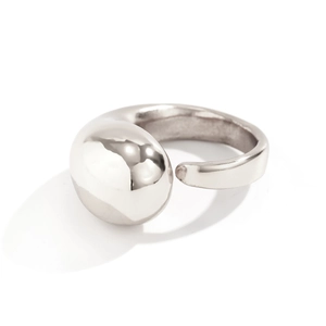 Macro detail of silver minimalist open ring with polished droplet and organic fluid shape
