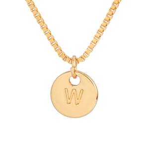 Close-up of golden round pendant with engraved letter W on a classic box chain