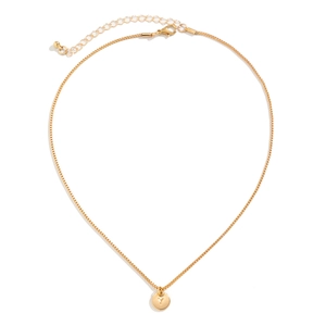 Macro detail of gold letter Y round pendant necklace with box chain and lobster clasp