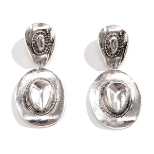 Detailed view of vintage cowboy hat drop earrings with antique silver finish and texture