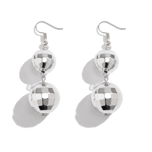 Detail of silver disco ball earrings with faceted geometric spheres and fishhooks