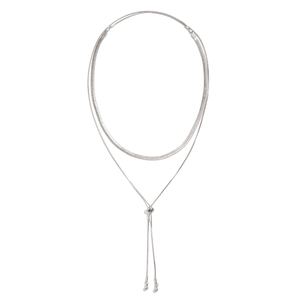 Detail of silver double-layered snake chain necklace with slider knot and metal beads
