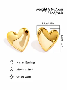 Detailed view of large gold heart stud earrings showing dimensions 3.8cm and 8.9g weight