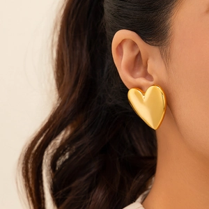 Polished gold heart drop earrings featuring a minimalist metallic fold design for women