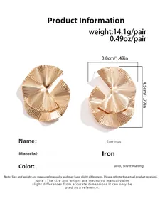 Detailed view of layered fan-shaped gold iron earrings with pleated texture and dimensions
