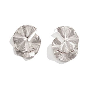 Detail of silver geometric earrings featuring layered pleated spiral textures and modern design