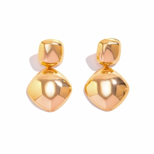 Detailed view of gold geometric layered earrings with high polish mirror finish