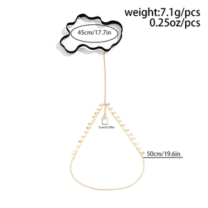Golden star pendant leg chain with black elastic thigh band and hanging metallic tassels