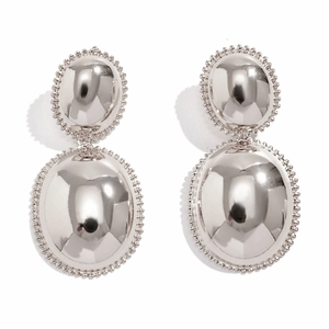 Detailed macro view of silver double oval earrings with beaded edges and mirror finish