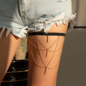 Bohemian multi-layer gold leg chain with star metal pendants and elastic black band