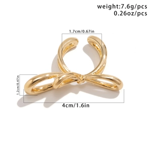 Detailed view of large golden metallic bow ring with precise size and weight measurements