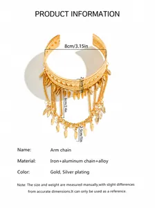 Detail of bohemian gold arm chain with metal leaf pendants and multi-layer fringe tassels