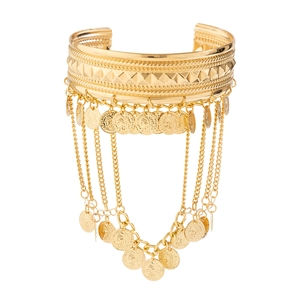 Detailed view of gold western cowboy arm chain with bohemian coin tassels and relief pattern