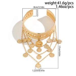 Detailed view of bohemian gold arm cuff with coin tassels and dimension measurements