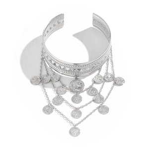 Detail of silver western cowboy arm chain with bohemian coin tassels and cutout patterns