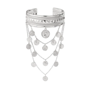 Detail of silver western cowboy arm cuff featuring metal fringes and coin charms