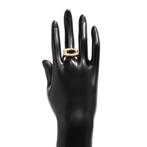 Detail of gold-plated irregular ring with hammered texture on black hand model