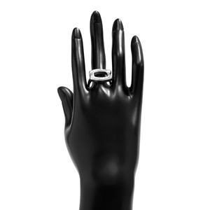 Detail of silver textured metal ring with rectangular cutout on a hand model