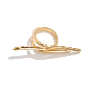 Macro shot of gold metallic minimalist intertwined double-finger ring with polished finish