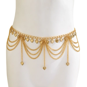 Detail showing layers of gold star waist chains with heart charms on model