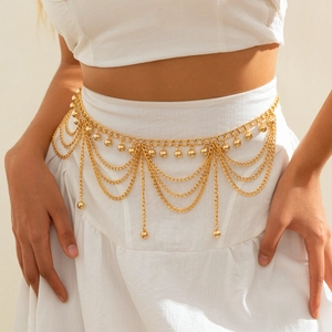 Detail of gold multi-layer tassel waist chain with metallic beads and layered fringe