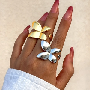 Statement butterfly wrap ring in polished gold and silver finish with adjustable band