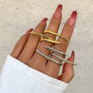 Minimalist gold and silver curved geometric rings set for multi-finger stacking