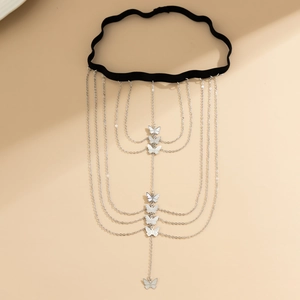 Detail of multi-layer butterfly tassel leg chain with silver stars and elastic band