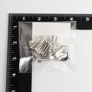 Detailed view of silver metallic pleated hairpins shown with a measuring ruler for size guide