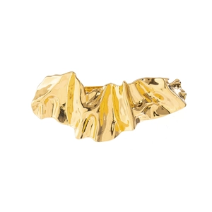 Detail of irregular pleated gold metal hairpin with liquid texture and mirror finish