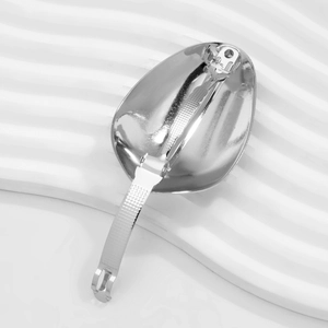Close-up of the spring clip structure on a minimalist silver metal teardrop hairpin