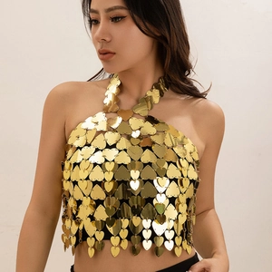 Detailed view of a golden heart-shaped sequin halter top with metallic chain links