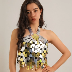 Detail of gold and silver heart-shaped sequins on a metallic halter body chain top