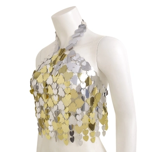 Detailed close-up of heart-shaped metal sequins on a bikini body chain halter top