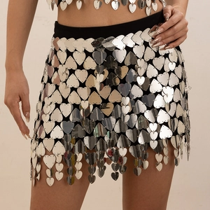 Detail of silver heart-shaped sequins connected by metal rings on a party mini skirt