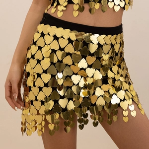 Detailed macro view of heart-shaped gold sequins on a black mesh bikini body chain set