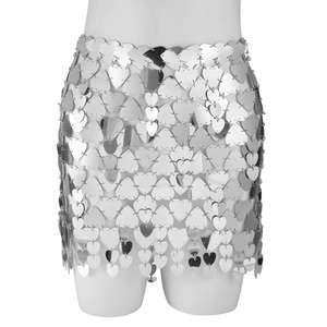 Detailed macro of silver heart-shaped sequins connected by metal rings on a mini skirt