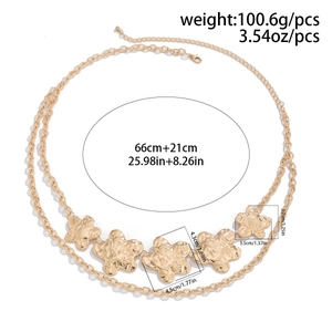 Macro detail of gold-tone double-layered waist chain featuring hammered metal flowers