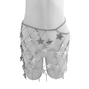 Macro detail of shiny silver star sequins and metal mesh body chain on a model