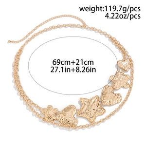 Detail of layered gold metal waist chain with hammered heart and starfish charms