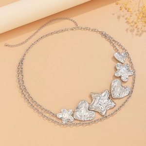 Silver punk waist chain with hammered heart, star, and flower charms in layered style