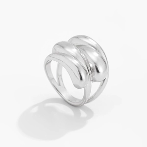 Detail of silver water-drop ring featuring a wide fluid metal design and glossy finish