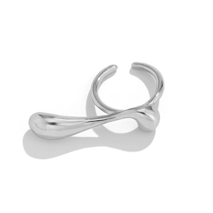 Macro view of polished silver liquid metal ring featuring irregular fluid design and texture