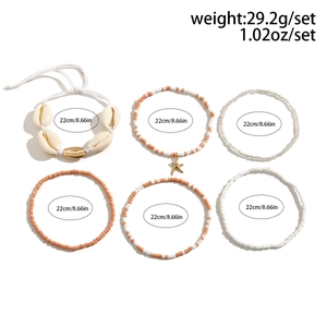 Macro view of bohemian shell and starfish bead bracelets with detailed dimension tags