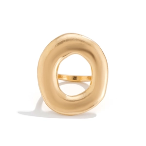 Macro shot of irregular hollow circular gold ring with refined matte frosted texture