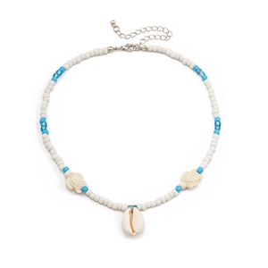 Detail of beaded sea turtle necklace with starfish and shell charms for beach style
