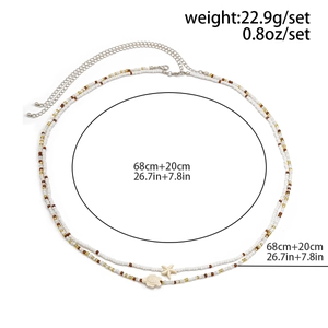 Vue détaillée de la chaîne de taille double couche style océan avec pendentif étoile de mer