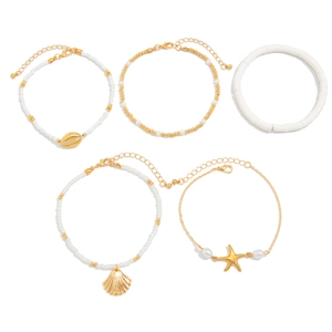 Detailed view of 5-piece beach ocean style waist chain with gold shell and starfish charms
