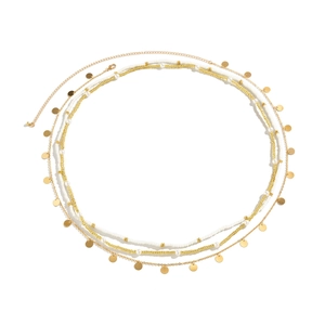 Detail of layered waist chain featuring white beads, gold pearls and round metal sequins