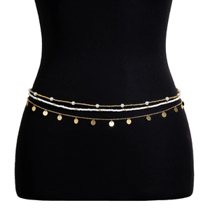 Detailed close-up of multi-layer bohemian waist chain with gold sequins and white beads